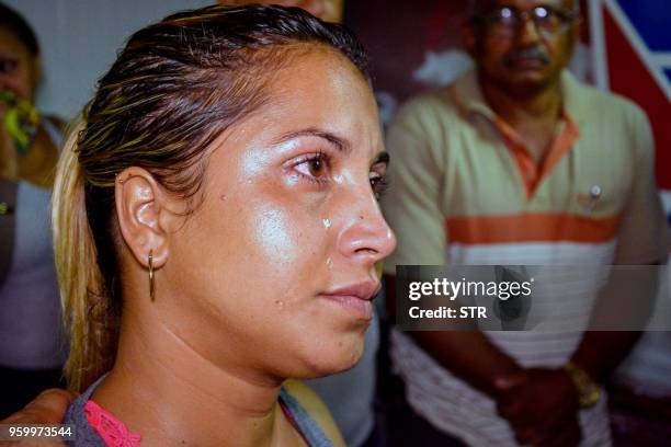 Relative of one of the victims of a plane crash is pictured at Holguin airport, after a Cubana de Aviacion aircraft crashed after taking off from...