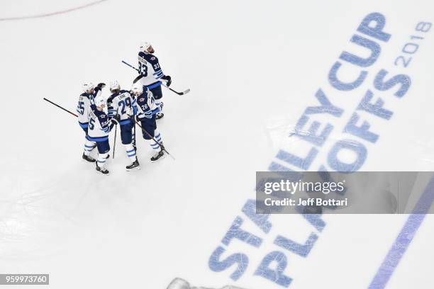 Patrik Laine celebrates his goal with teammates Paul Stastny, Mark Scheifele, Blake Wheeler and Dustin Byfuglien of the Winnipeg Jets against the...