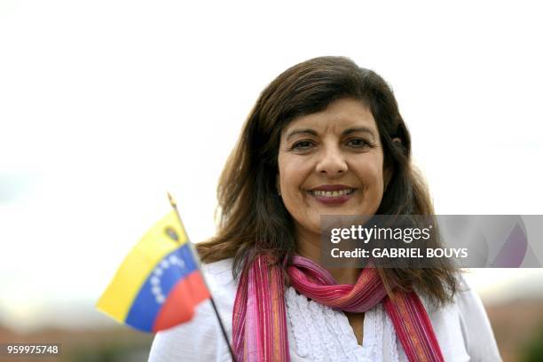 Venezuelan Maria Argelia Jaspe Alvarez poses in Madrid on May 14, 2018 - Exiled Venezuelans have no expectations of the presidential election taking...