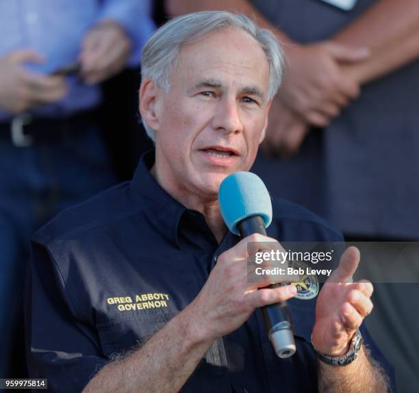 Texas Governor Greg Abbott speaks to family and friends at a vigil held at the First Bank in Santa Fe for the victims of a shooting incident at Santa...