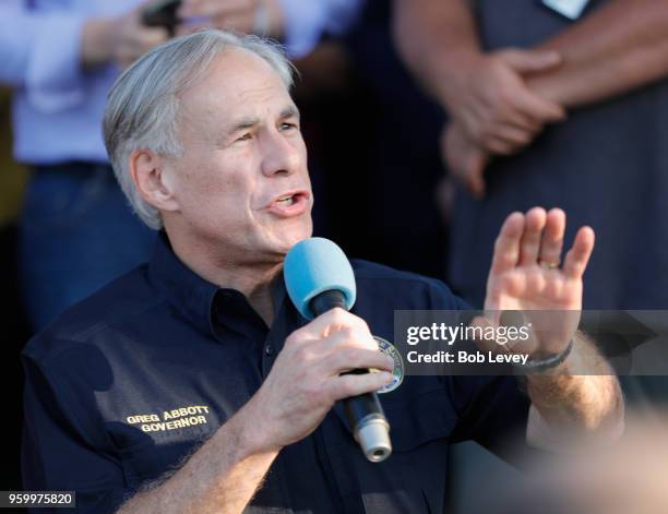 Texas Governor Greg Abbott speaks to family and friends at a vigil held at the First Bank in Santa Fe for the victims of a shooting incident at Santa...