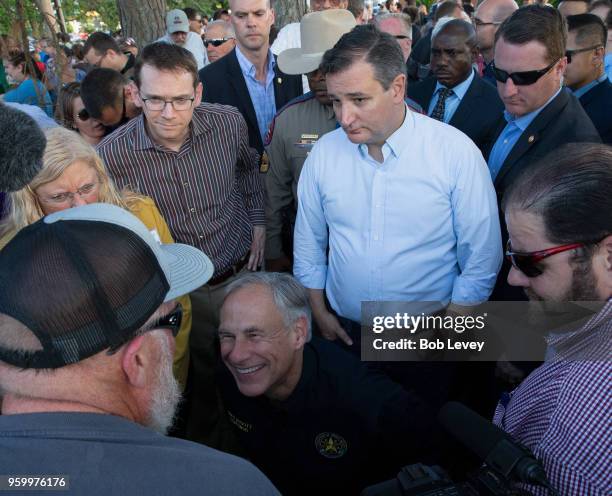 Texas Governor Greg Abbott and Sen. Ted Cruz speaks to family and friends at a vigil held at the First Bank in Santa Fe for the victims of a shooting...