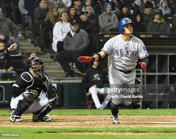 Shin-Soo Choo of the Texas Rangers watches his grand-slam home run against the Chicago White Sox during the third inning on May 18, 2018 at...