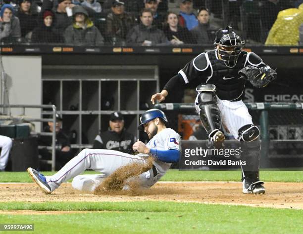 Joey Gallo of the Texas Rangers is forced out at home plate by Welington Castillo of the Chicago White Sox during the third inning on May 18, 2018 at...