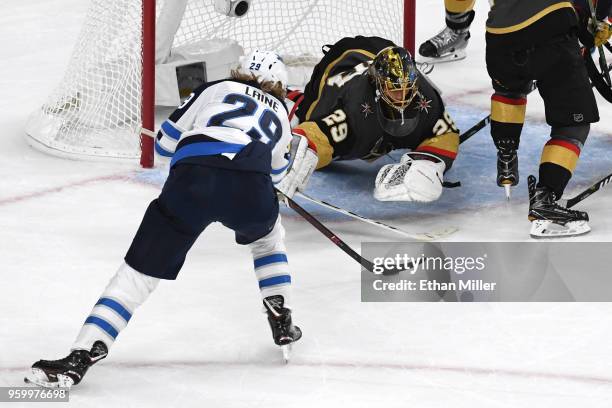 Marc-Andre Fleury of the Vegas Golden Knights makes a diving save against Patrik Laine of the Winnipeg Jets during the second period in Game Four of...
