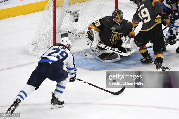 Marc-Andre Fleury of the Vegas Golden Knights makes a diving save against Patrik Laine of the Winnipeg Jets during the second period in Game Four of...