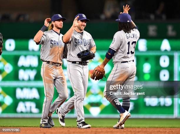 Matt Szczur celebrates with Freddy Galvis of the San Diego Padres after a 3-2 win over the Pittsburgh Pirates at PNC Park on May 18, 2018 in...