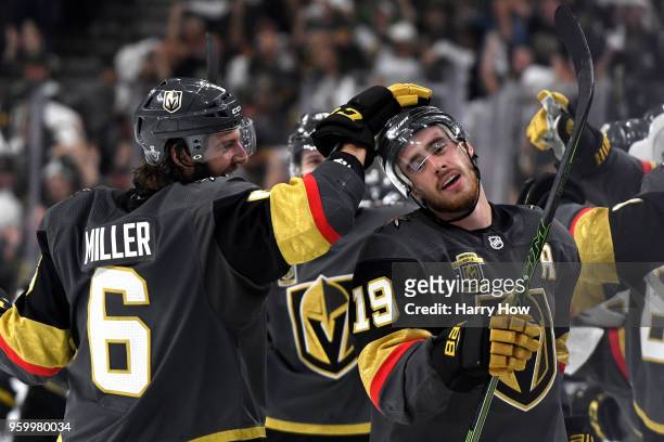Reilly Smith is congratulated by his teammate Colin Miller of the Vegas Golden Knights after scoring a third-period goal against the Winnipeg Jets in...