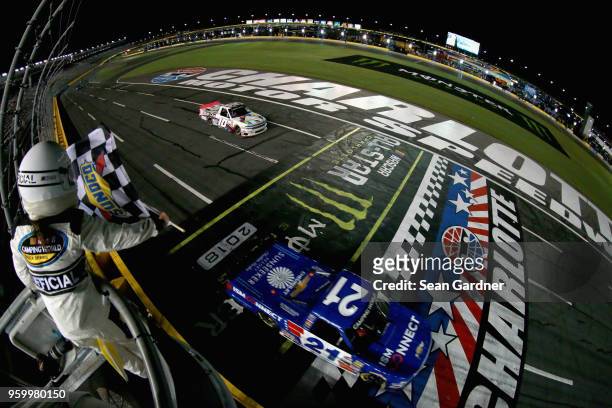 Johnny Sauter, driver of the ISM Connect Chevrolet, takes the checkered flag to win the NASCAR Camping World Truck Series North Carolina Education...