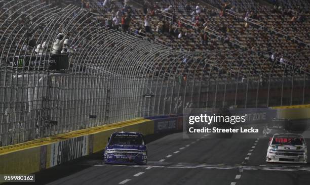 Johnny Sauter, driver of the ISM Connect Chevrolet, takes the checkered flag to win the NASCAR Camping World Truck Series North Carolina Education...