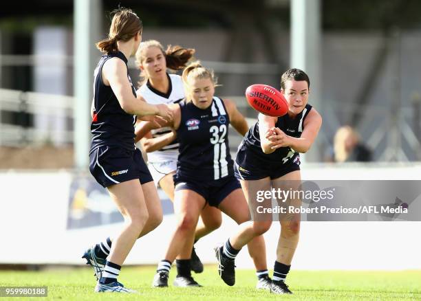 Luka Lesosky-Hay of Geelong handballs during the TAC Cup Girls Grand Final match between Geelong and the Northern Knights at Avalon Airport Oval on...