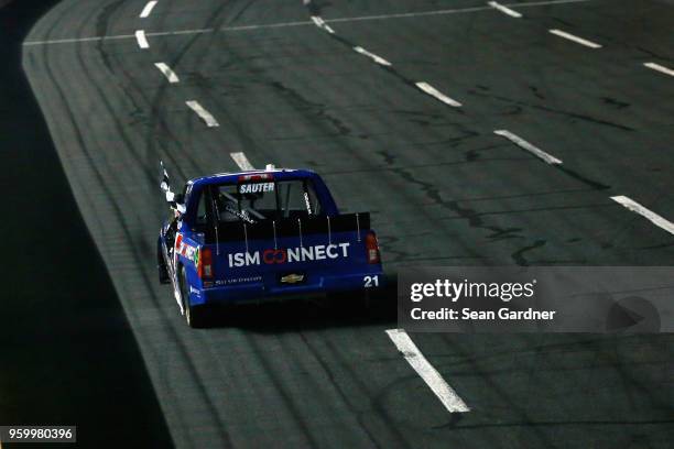 Johnny Sauter, driver of the ISM Connect Chevrolet, celebrates with the checkered flag after winning the NASCAR Camping World Truck Series North...