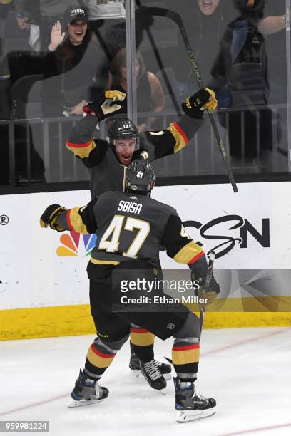 Reilly Smith is congratulated by his teammate Luca Sbisa of the Vegas Golden Knights after scoring a third-period goal against the Winnipeg Jets in...