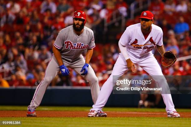 Jake Arrieta of the Philadelphia Phillies leads off first base against Jose Martinez of the St. Louis Cardinals in the third inning at Busch Stadium...