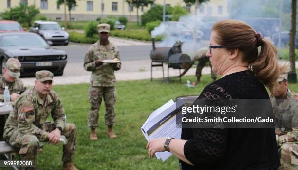 Photograph of Mary Cron, Financial Readiness Manager at the US Army Garrison in Bavaria, speaking to a group of soldiers from the 7th Army Training...
