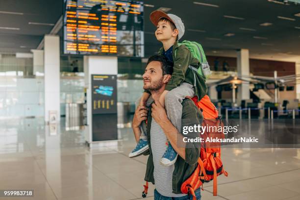 waiting for the flight - carrying sign imagens e fotografias de stock