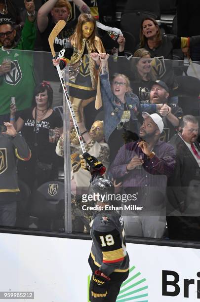 Reilly Smith of the Vegas Golden Knights gives a stick to a fan after being named the first star of the game after his team's win against the...