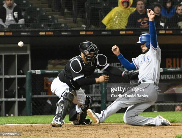 Isiah Kiner-Falefa of the Texas Rangers is safe at home as Welington Castillo of the Chicago White Sox can't handle the throw during the ninth inning...