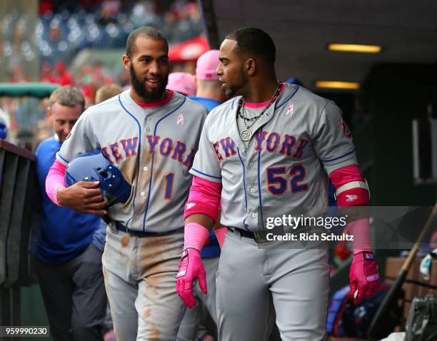 Amed Rosario and Yoenis Cespedes of the New York Mets in action against the Philadelphia Phillies in a game at Citizens Bank Park on May 13, 2018 in...
