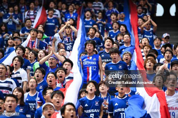 Yokohama F.Marinos supporters cheer prior to the J.League J1 match between Yokohama F.Marinos and V-Varen Nagasaki at Nissan Stadium on May 19, 2018...