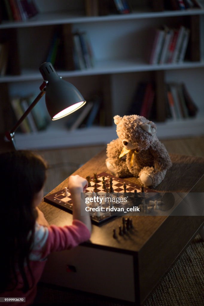 Girl plays chess