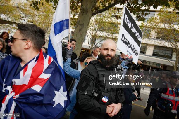 Australian right-wing political activist Avi Yeminis security men protest against Palestinian activists who formed a march to commemorate the 70th...