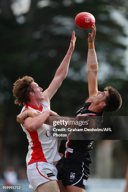 Lachlan Filipovic of the Casey Demons and Lewis Pierce of Frankston compete for the ball during the VFL round seven match between Frankston and Casey...