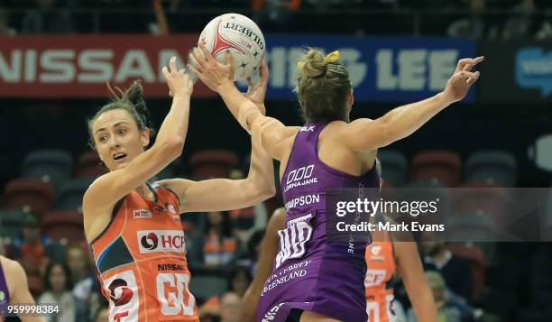 Bec Bulley of the Giants competes for the ball with Gabi Simpson of the Firebirds during the round four Super Netball match between the Giants and...