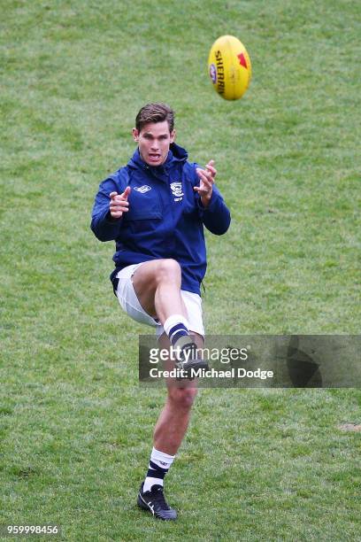 Tom Hawkins of the Cats kicks the ball in the warm up during the round nine AFL match between the Essendon Bombers and the Geelong Cats at Melbourne...