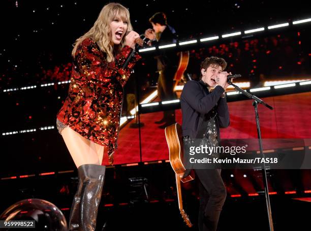 Taylor Swift and Shawn Mendes perform onstage during the Taylor Swift reputation Stadium Tour at the Rose Bowl on May 18, 2018 in Pasadena,...
