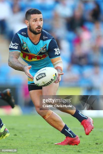 Nathan Peats of the Titans passes during the round 11 NRL match between the Gold Coast Titans and the Newcastle Knights at Cbus Super Stadium on May...