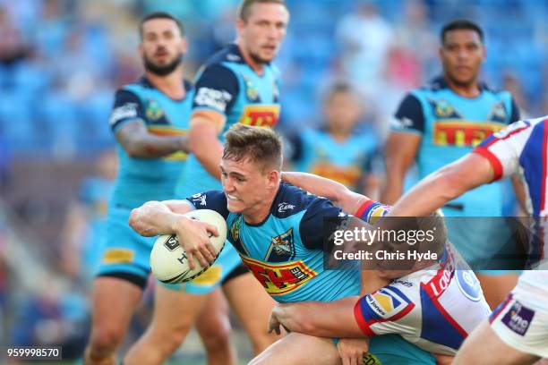 Alexander Brimson of the Titans is tackled during the round 11 NRL match between the Gold Coast Titans and the Newcastle Knights at Cbus Super...