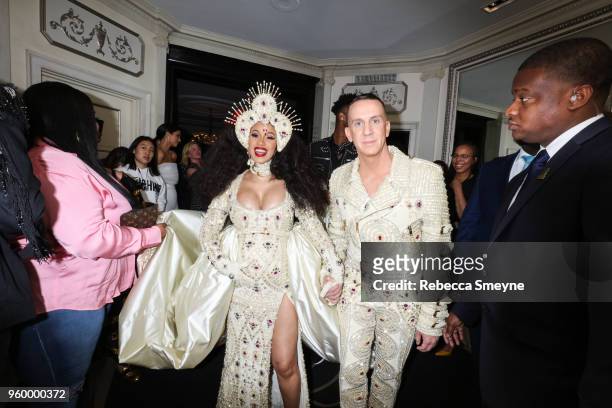 Cardi B and Jeremy Scott depart for the Met Gala in the lobby of the Carlyle Hotel on May 7, 2018 in New York, New York.