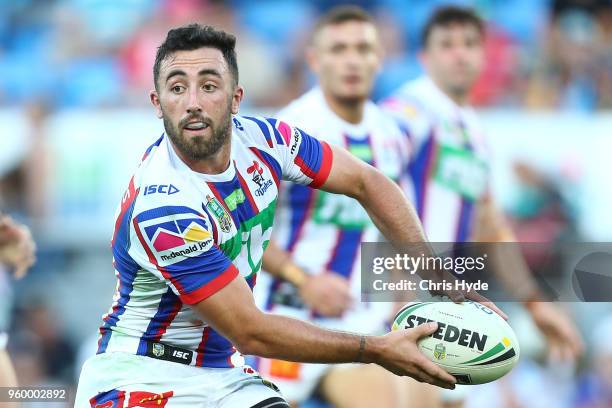 Connor Watson of the knights passes during the round 11 NRL match between the Gold Coast Titans and the Newcastle Knights at Cbus Super Stadium on...