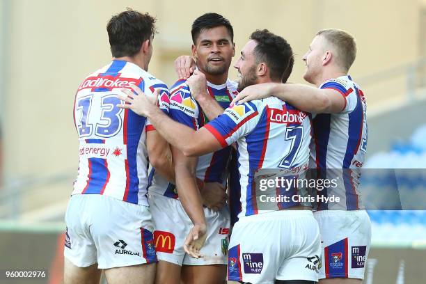 Herman Ese'ese of the Knights celebrates a try during the round 11 NRL match between the Gold Coast Titans and the Newcastle Knights at Cbus Super...