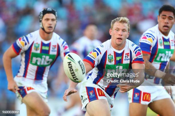 Slade Griffin of the Knights passes during the round 11 NRL match between the Gold Coast Titans and the Newcastle Knights at Cbus Super Stadium on...