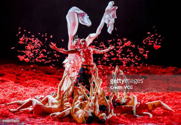 Dancers perform during dancer Yang Liping's modern dance drama 'Under Siege' at Guangxi Art and Culture Center on May 18, 2018 in Nanning, Guangxi...