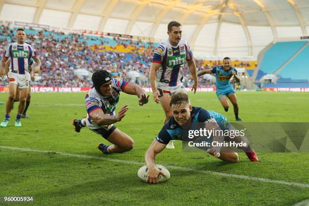 Alexander Brimson of the Titans scores a try during the round 11 NRL match between the Gold Coast Titans and the Newcastle Knights at Cbus Super...