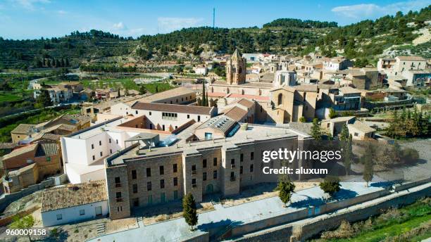 vallbona de les monges known because of the beautiful cistercian monastery located in the village. founded in the xii century its architecture is characteristic of the romanic-gothic style. - abbey monastery stock pictures, royalty-free photos & images