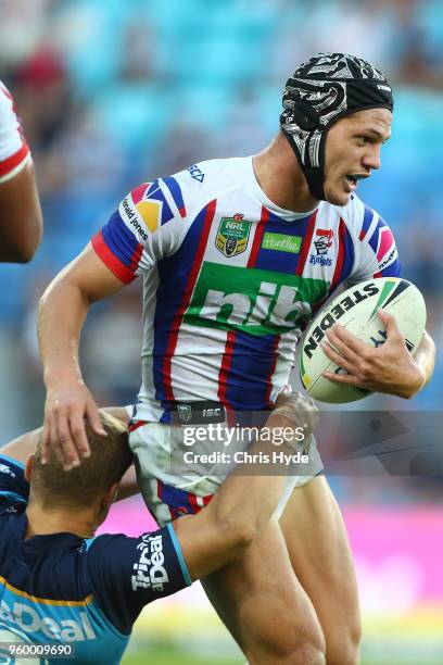 Kalyn Ponga of the Knights runs the ball during the round 11 NRL match between the Gold Coast Titans and the Newcastle Knights at Cbus Super Stadium...