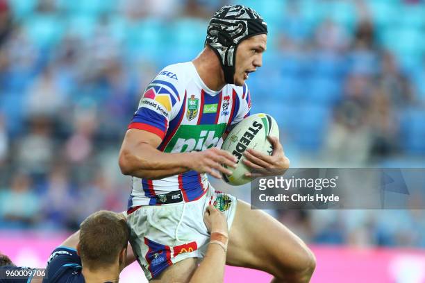 Kalyn Ponga of the Knights runs the ball during the round 11 NRL match between the Gold Coast Titans and the Newcastle Knights at Cbus Super Stadium...
