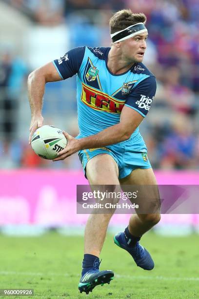 Mitchell Rein of the Titans runs the ball during the round 11 NRL match between the Gold Coast Titans and the Newcastle Knights at Cbus Super Stadium...