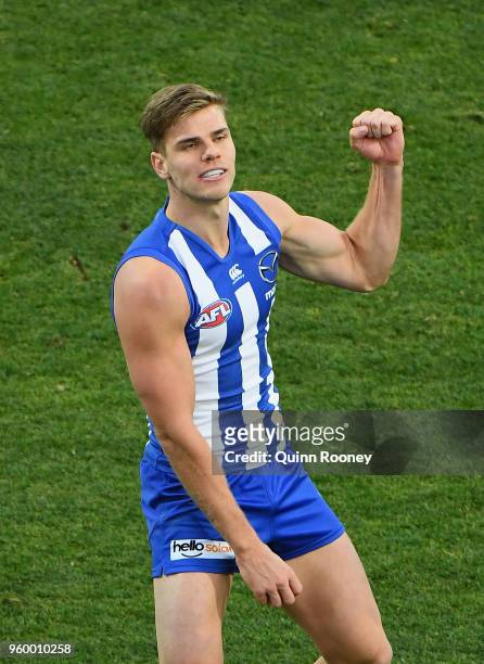Mason Wood of the Kangaroos celebrates kicking a goal during the round nine AFL match between the North Melbourne Kangaroos and the Greater Western...