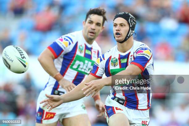 Kalyn Ponga of the Knights passes during the round 11 NRL match between the Gold Coast Titans and the Newcastle Knights at Cbus Super Stadium on May...