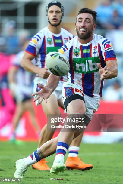 Brock Lamb of the Knights passes during the round 11 NRL match between the Gold Coast Titans and the Newcastle Knights at Cbus Super Stadium on May...