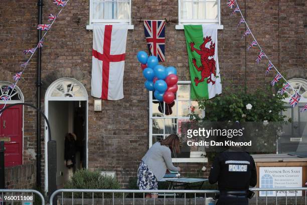 Members of the public prepare along the procession route near Windsor Castle prior to the wedding of HRH Prince Harry to Ms. Meghan Markle on May 19,...