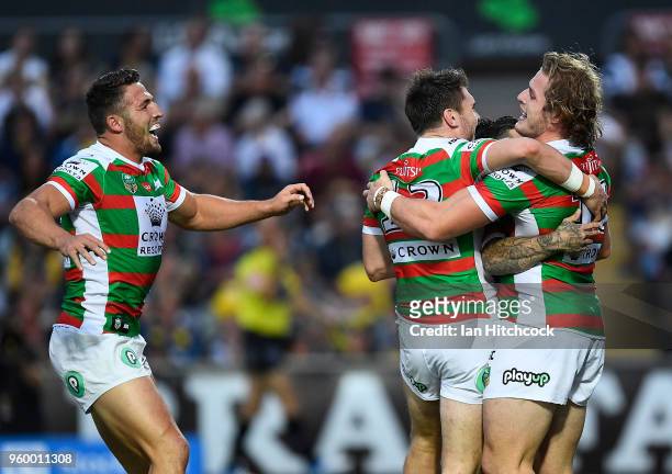 George Burgess of the Rabbitohs celebrates after scoring a try during the round 11 NRL match between the North Queensland Cowboys and the South...
