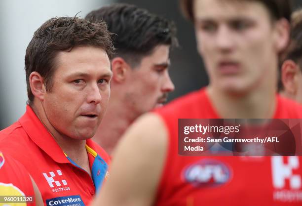 Stuart Dew, Senior Coach of the Suns shows his emotions after addressing his player during the 2018 AFL round nine match between the Gold Coast Suns...