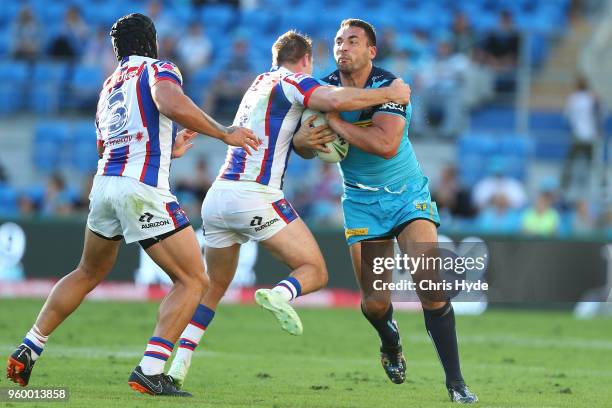 Ryan James of the Titans runs the ball during the round 11 NRL match between the Gold Coast Titans and the Newcastle Knights at Cbus Super Stadium on...