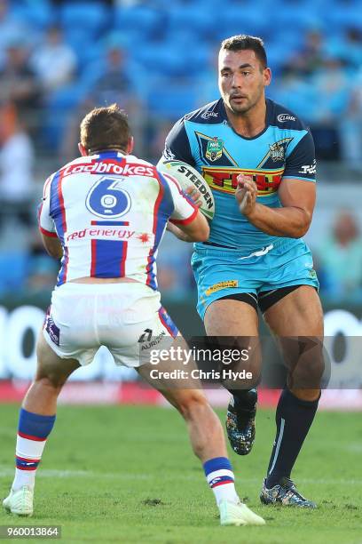 Ryan James of the Titans runs the ball during the round 11 NRL match between the Gold Coast Titans and the Newcastle Knights at Cbus Super Stadium on...